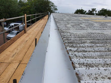 Load image into Gallery viewer, Gutter liner on factory roof.
